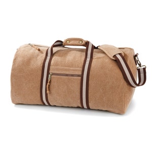 May include: A tan canvas duffel bag with brown and white striped straps. The bag has a zippered pocket on the front and a top handle.