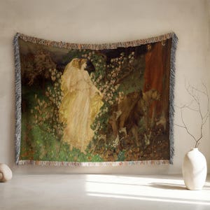 May include: Woven tapestry throw blanket depicting a classical painting with figures in flowing gowns, lions, and other animals in a forest setting. The artwork has a vintage aesthetic with a fringed edge.