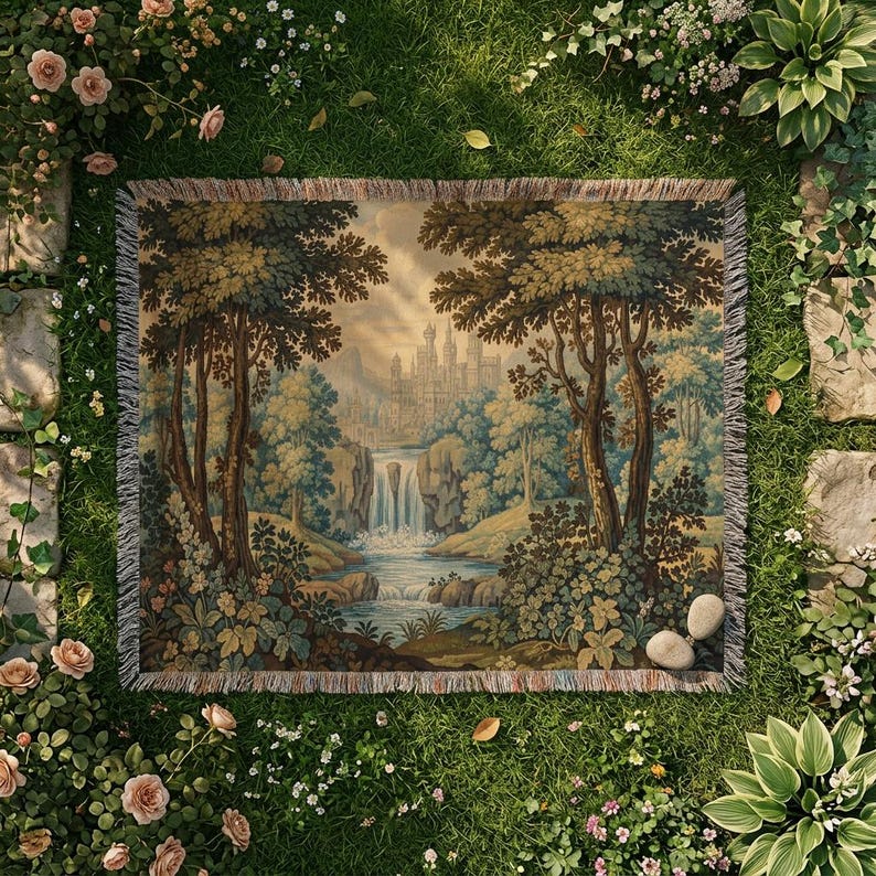 May include: A rectangular tapestry featuring a scenic landscape with a waterfall, trees, and a castle in the distance. The tapestry has a fringed edge and is set on a bed of green grass, surrounded by flowers and stone pathways.