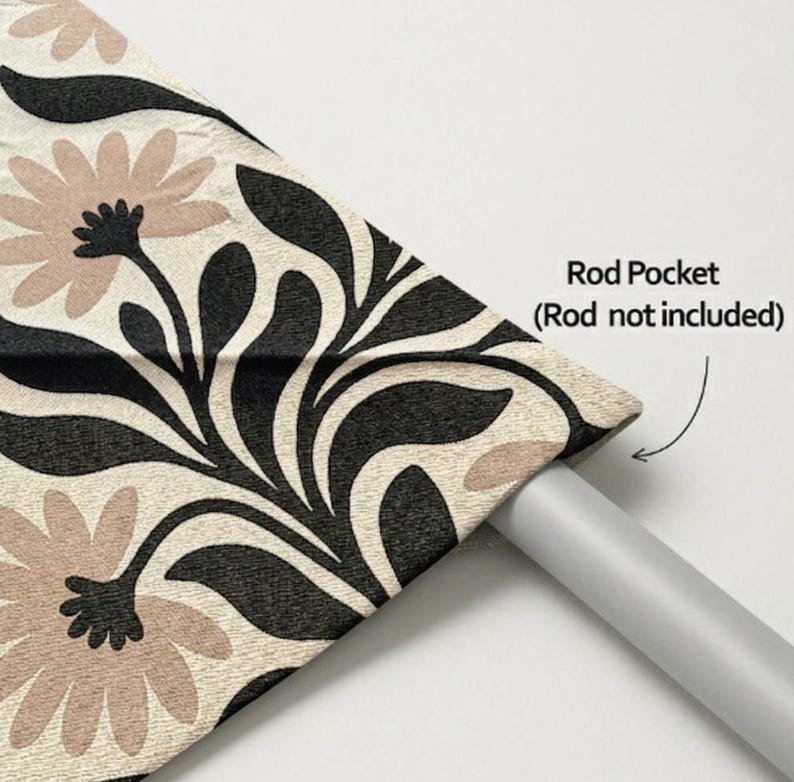 May include: A curtain panel featuring a cream-colored fabric with a repeating pattern of large, light brown flowers and bold black leaves. The top edge includes a rod pocket for hanging, with text indicating Rod Pocket (Rod not included).