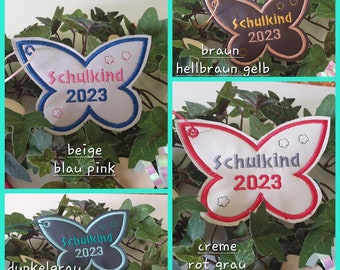 Schulkind 2024 | Taschenbaumler | Anhänger Schultüte Name Schmetterling