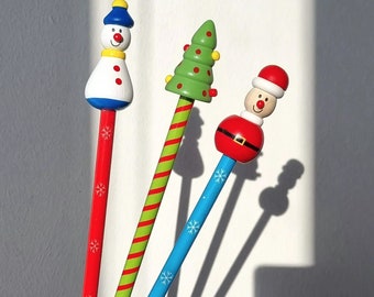 Funny pencil with Christmas figure