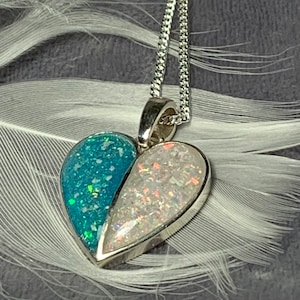 Cremation ashes split heart pendant . Sterling silver. Ideal for two sets of ashes