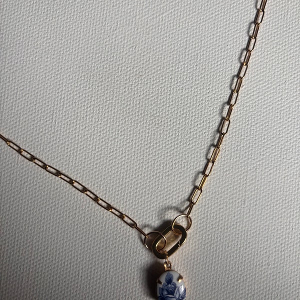 Dainty Gold Paperclip Chain Necklace with Blue and White Ceramic Flower Charm on Caribeaner