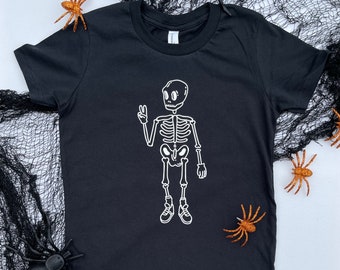 Bad 2 the Bone Skeleton Peace Sign Toddler Halloween T-Shirt | Toddler Graphic Tee Halloween Skeleton | Skater kid skeleton Shirt
