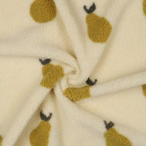 May include: Off-white fabric featuring a repeating pattern of yellow-green pears and dark grey stems. The fabric has a soft, textured appearance, with the pear shapes evenly spaced. The pears are a fuzzy, textured material.