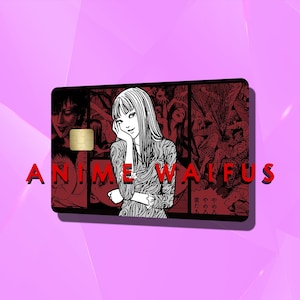 以下が含まれることがあります： 赤と白のアニメ風イラストが描かれた黒いクレジットカード。カードには金色のチップと赤い文字で「ANIME WALFUS」と書かれています。背景は薄い紫です。