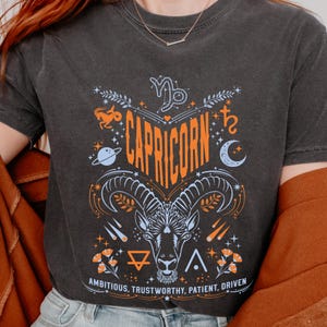 Capricorn Astrology Graphic T-shirt, Zodiac Goat Moon Stars, Blue and Orange Design