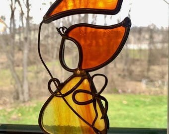 1970s Stained Glass Girl with Kite Suncatcher Amber Orange Window Decor