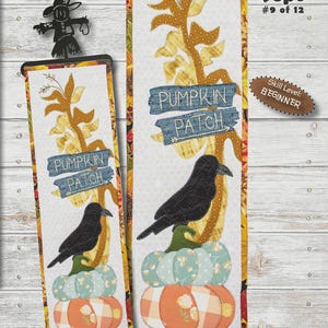 May include: A fabric panel with a pumpkin patch theme. The panel features a black crow perched on pumpkins, with the text "PUMPKIN PATCH". The panel measures 6" x 20". The skill level is beginner.