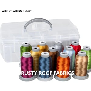 May include: A clear plastic storage case with a gray handle, filled with colorful spools of thread. The thread colors include green, gold, brown, silver, red, blue, orange, and pink. The text "RUSTY ROOF FABRICS" is visible.
