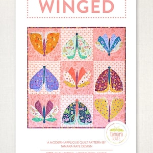 May include: A quilt pattern titled "WINGED" featuring nine butterfly designs in various colors and patterns. The butterflies are set against a pink background. The pattern is by Tamara Kate Design and includes sizes for small throw, large throw, and single quilts.