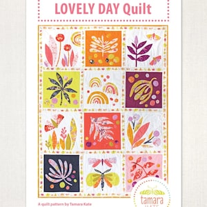 May include: A quilt pattern titled "LOVELY DAY Quilt" featuring colorful floral and insect designs. The pattern includes squares with illustrations of leaves, flowers, butterflies, and rainbows. The designer's name, Tamara Kate, is also visible.