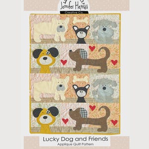 May include: A colorful quilt pattern featuring appliqued dog designs. The quilt showcases various dog breeds in cream, brown, yellow, and gray, with heart and bone accents. The text "Lucky Dog and Friends" is displayed at the bottom.