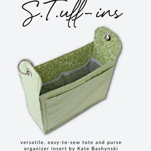 May include: A light green tote and purse organizer insert, with a patterned interior, is featured on a white background. The text "S.Tuff-ins" is displayed above the product. The bottom of the image includes the Sallie Tomato logo and text.