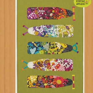 May include: A green fabric panel featuring five colorful ironing board designs with floral patterns. The panel is 28 inches by 42 inches. The text "Pressing Matters" and "Everyday Stitches" are displayed at the top and bottom, respectively. The panel is for everyday quilters.