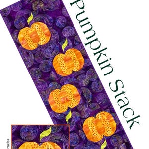 May include: A rectangular quilt pattern featuring a repeating design of orange pumpkins with green stems on a purple background. The text "Pumpkin Stack" is displayed vertically. The pattern measures 15.5 inches by 48.5 inches.