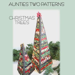 May include: Two fabric Christmas trees, one large and one small, with red star toppers. The trees are made from fabric strips and decorated with festive patterns. The large tree is 16" x 7", and the small tree is 8.5" x 5". The text "Christmas Trees" is at the top.