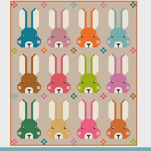 May include: A colorful quilt featuring a repeating pattern of geometric cottontail rabbits in various colors. The quilt sizes include crib (55" x 48"), throw (72" x 63"), twin (95" x 78"), and queen (107" x 90"). The text "COTTONTAIL RABBITS" is at the top.