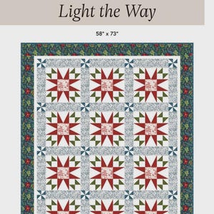 May include: A patchwork quilt with a repeating star pattern in red, green, and white, framed by a dark green border with floral accents. The quilt measures 58" x 73" and features the text "Light the Way".