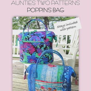 May include: Two quilted tote bags. The top bag has a floral pattern in blue, purple, and green. The bottom bag has a beach scene and blue and green stripes. The bags are 18 inches wide, 12 inches deep, and 14 inches tall.