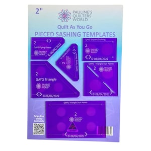 May include: A set of purple quilting templates with the text "Quilt As You Go" and "Pieced Sashing Templates." The set includes templates for QAYG Flying Geese, Square Sashing, Triangle, and Triangle Star Points. The package is 2 inches in height.