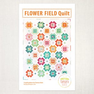 May include: A quilt pattern titled "Flower Field Quilt" featuring a colorful floral design. The quilt pattern includes a variety of colors, including orange, pink, green, and blue. The pattern is by Tamara Kate.