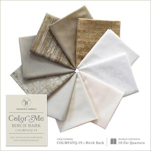 May include: A fabric bundle featuring ten fat quarters in neutral tones of beige, cream, and tan. The fabrics are arranged in a circular pattern, with various textures and patterns. The label reads "Color Me Birch Bark" by Windham Fabrics.