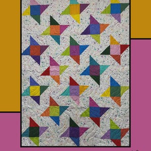 May include: A colorful quilt with star patterns. The quilt features a white background with small floral patterns and colorful star designs in shades of blue, green, yellow, orange, purple, and red. The word "Awestruck" is at the top.