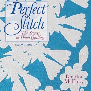 May include: A book cover titled "That Perfect Stitch" with the subtitle "The Secrets of Hand Quilting." The cover features a blue background with white quilted floral designs. The author's name, Dierdra McElroy, is also visible.