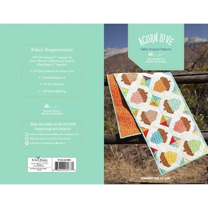 May include: A table runner pattern called "Acorn Love" by Lori Holt of Bee in my Bonnet. The pattern features a design of acorns and leaves in shades of brown, orange, green, and blue. The finished size of the table runner is 15 inches by 65 inches.