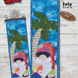 May include: A fabric panel featuring a gnome in sunglasses and a colorful hat, with a beach scene and palm trees. The panel is 6 inches by 20 inches. Text includes "PANAMA JACK" and "July #7 of 12". Skill level: EASY.