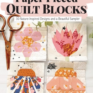 May include: A book cover titled "Wonderful World of Paper Pieced Quilt Blocks" with four floral quilt block designs. The book features 30 nature-inspired designs. A pair of vintage scissors rests on the cover.