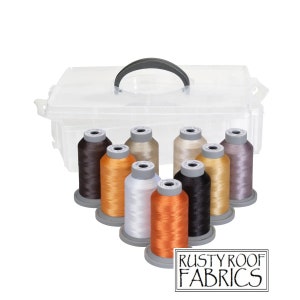 May include: A clear plastic storage box with a handle, containing eight spools of thread in various colors, including brown, orange, white, black, and gray. The box is labeled "Rusty Roof Fabrics".