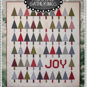 May include: A quilted Christmas tree pattern with the word "JOY" in red. The quilt features various patterned trees in red, green, gray, and blue. The quilt is 69" x 81" and is titled "Tree Lot". The top banner reads "Primitive Gatherings".