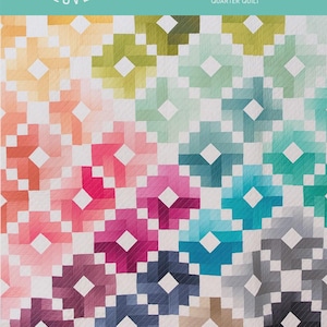 May include: A colorful quilt pattern titled "Ombre Gems" with a geometric design. The quilt features a gradient of colors, including orange, pink, blue, and green. The text "Quilty Love" is at the top left.