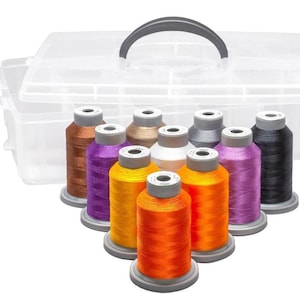 May include: A clear plastic storage case with a handle, containing ten spools of thread in various colors, including orange, yellow, purple, brown, black, and white.