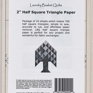 May include: A package of 25 sheets of 2" Half Square Triangle Paper from Laundry Basket Quilts. The paper makes 700 half square triangles. The package has a tree design and the text "LBQ-0222".