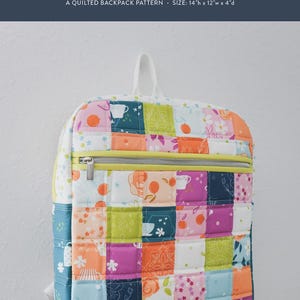 May include: A quilted Phoenix backpack pattern with a patchwork design. The backpack is made of colorful squares in various patterns and colors, including floral and geometric designs. The backpack measures 14 inches high, 12 inches wide, and 4 inches deep.