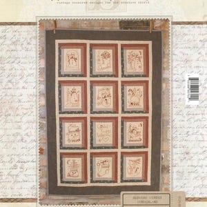 May include: A patchwork quilt with a winter theme. The quilt features twelve squares with embroidered snowman designs in red and beige. The quilt is framed with a dark brown border and measures 35" x 38". The text "Redwork Winter Wonderland" is visible.