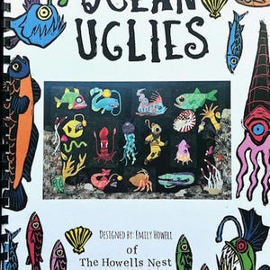 May include: A spiral-bound print titled "Ocean Uglies" featuring colorful, cartoonish illustrations of various sea creatures. The print includes the text "Designed by Emily Howell of The Howells Nest" and measures 40.5 inches by 61 inches.