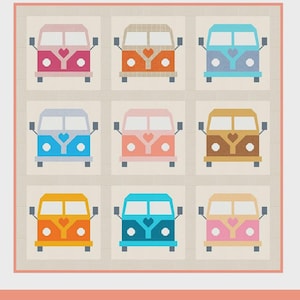 May include: A quilt featuring nine colorful, stylized camper vans with heart-shaped details. The text "ON THE ROAD Vol.2" is at the top. The quilt sizes are: crib 50" x 50", small throw 50" x 66", and large throw 66" x 66".