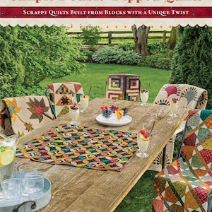May include: A book cover titled "Simple Double-Dipped Quilts" by Kim Diehl. The cover features a wooden table set for a meal, with colorful quilts draped over chairs. The table is set with desserts and drinks, with a garden in the background.