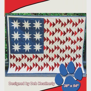May include: A patriotic quilt with a blue field of stars and red and white stripes. The quilt measures 38" x 54". The design is called "Salute" and is by Deb Heatherly. The pattern uses Creative Grids tools.