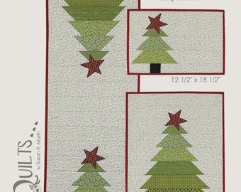 May include: A quilt pattern titled "Christmas Pines" featuring three quilt designs with Christmas tree motifs. The pattern includes measurements of 16" x 44 1/2", 12 1/2" x 18 1/2", and 18 1/2" x 22 1/2". The design includes green trees with red star toppers.
