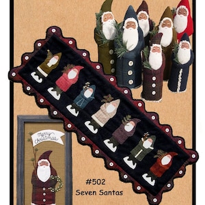 May include: A folk art design featuring seven Santa Claus figures. The image includes a table runner with Santa figures, a framed picture, and 3-D Santa figures. The text reads "All Through the Night" and "Seven Santas". The table runner is 16 inches by 44 inches.