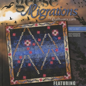 May include: A quilt pattern book titled "Geese Migrations" by Quiltworx. The cover features a quilt design with a dark blue background, blue and orange triangles, and pink starbursts. The quilt measures 90 x 90 inches. The book features 29 pattern designs.