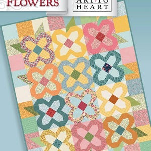 May include: A colorful quilt with a floral pattern, featuring large, stylized flower shapes in various colors like pink, yellow, and orange. The quilt includes the text "FIELD OF FLOWERS" and "ART TO HEART". The pattern includes a 36" x 36" table topper and an 18" x 42" table runner.