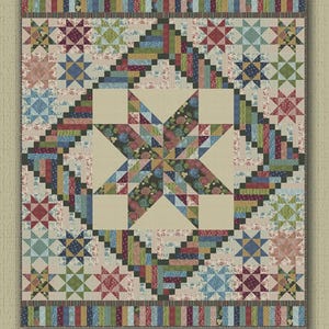 May include: A colorful quilt pattern titled "Broken Star" with a central star design and various geometric shapes. The quilt features fabrics from the Allure Noir collection and measures 73 x 86 inches.