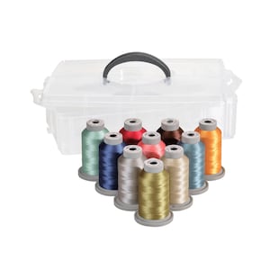 May include: A clear plastic storage box with a handle, containing 10 spools of thread in various colors, including teal, navy blue, beige, gold, coral, brown, and light blue.